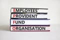 EPFO, employees provident fund organisation symbol. Concept words `EPFO, employees provident fund organisation` on books.