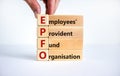 EPFO, employees provident fund organisation symbol. Wooden cubes with words `EPFO, employees provident fund organisation.