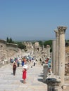 Ephesus. Curetes street and Celsus library. Tourists walking among ruins of the ancient city Royalty Free Stock Photo