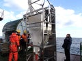 The Sea of Japan / Russia - December 01 2013: Epibenthic sledge and science team on the deck of research vessel