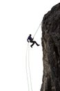 Epic Adventurous Extreme Sport Composite of Rock Climbing Man Rappelling from a Cliff. Royalty Free Stock Photo