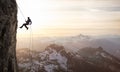 Epic Adventurous Extreme Sport Composite of Rock Climbing Man Rappelling Royalty Free Stock Photo