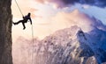 Epic Adventurous Extreme Sport Composite of Rock Climbing Man Rappelling from a Cliff Royalty Free Stock Photo