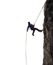 Epic Adventurous Extreme Sport Composite of Rock Climbing Man Rappelling from a Cliff. Royalty Free Stock Photo