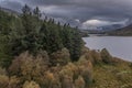 Epic aerial flying drone landscape image of Snowdon Massif viewed from above Llynau Mymber during Autumn sunset with dramatic sky Royalty Free Stock Photo