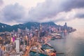 Epic aerial view of night scene of Victoria Harbour, Hong Kong, in golden hour Royalty Free Stock Photo