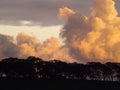 Epic clouds during sunset. Orange and yellow skies. Silhouette trees. Rural Australia.  Digital photograph landscape Royalty Free Stock Photo