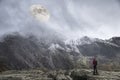 Epic digital composite image of Supermoon above mountain range giving very surreal fantasy look to the dramatic landscape image