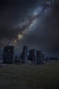 Epic digtial composite image of ibrant Milky Way over ancient monolithic standing stones in landscape