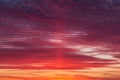 Epic Dramatic bright sunrise, sunset orange red pink sky with beautiful clouds in sunlight background texture Royalty Free Stock Photo