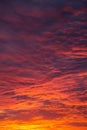 Epic Dramatic bright sunrise, sunset orange red sky with clouds in sunlight background texture Royalty Free Stock Photo