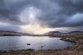 Epic dramatic landscape image of Loch Ba on Rannoch Moor in Scottish Highlands on a Winter morning Royalty Free Stock Photo