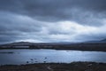 Epic dramatic landscape image of Loch Ba on Rannoch Moor in Scottish Highlands on a Winter morning Royalty Free Stock Photo
