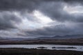 Epic dramatic landscape image of Loch Ba on Rannoch Moor in Scottish Highlands on a Winter morning Royalty Free Stock Photo