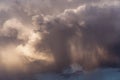 Epic Dramatic storm dark grey white cumulus clouds with rain in sunlight abstract background texture, thunderstorm Royalty Free Stock Photo