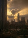 Epic and dramatic sun light through the clouds at sunset around the WTC in Abu Dhabi Royalty Free Stock Photo