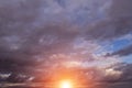 Epic dramatic sunset, sunrise on storm sky with dark clouds, orange yellow sun and sunlight, heaven Royalty Free Stock Photo