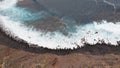 Epic drone shot - beach with black stones and turquoise water. El Pris, Tenerife, Canary islands, Spain