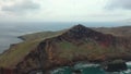 Majestic flight with a drone over the colorful coasts of Madeira in Portugal past a viewpoint called Ponta de So Loureno.