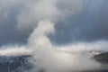 Epic landscape image of Skiddaw snow capped mountain range in Lake District in Winter with low level cloud around peaks viewed Royalty Free Stock Photo