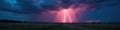 Epic lightning illuminates vast field Dramatic storm clouds, atmospheric perspective , sky, captivating landscape Royalty Free Stock Photo