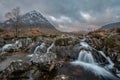 Epic majestic Winter sunset landscape of Stob Dearg Buachaille Etive Mor iconic peak in Scottish Highlands with famous River Etive Royalty Free Stock Photo