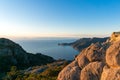 Epic mountain sunrise landscape with picturesque lagoon and large lava boulders