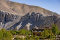 Epic rock formations and a temple and Nilgiri Mountain, Upper Mustang, Nepal, Annapurna