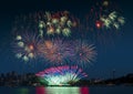 Epic Seattle fireworks display on celebration night, showing over the lake with multi color of reflection on water