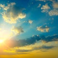 Epic sky landscape with bright sun and dark fantastically clouds