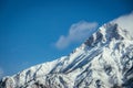 Epic snowy mountain peak with clouds in winter, landscape, alps, austria Royalty Free Stock Photo