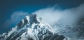 Epic snowy mountain peak with clouds in winter, landscape, alps, austria Royalty Free Stock Photo