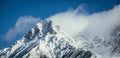 Epic snowy mountain peak with clouds in winter, landscape, alps, austria Royalty Free Stock Photo