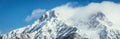 Epic snowy mountain peak with clouds in winter, landscape, alps, austria Royalty Free Stock Photo