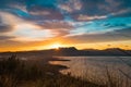 Epic sun setting on sierra tramuntana mountains from alcudia park in palma de mallorca. dramatic and scenic landscape of mallorca Royalty Free Stock Photo