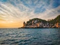 Epic sunset with beautiful orange red sun rays hitting on stones of a rocky island with blue sky and sea of Koh Tao Thailand. Koh Royalty Free Stock Photo
