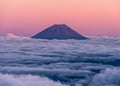 Epic sunset over volcano Mt. Fuji rising above an ocean of clouds. Seen from the summit of Mt. Kita Royalty Free Stock Photo