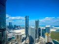 Epic top view shot of Al Reem island towers and landscape with a cloudy blue sky