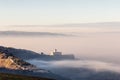 An epic view of St.Francis church in Assisi town Umbria above a sea of fog at dawn Royalty Free Stock Photo