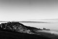 An epic view of St.Francis church in Assisi town Umbria above a sea of fog at dawn Royalty Free Stock Photo