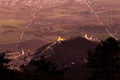 An epic view of St.Francis church and Rocca Maggiore in Assisi town Umbria above valley at sunset