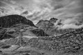 Epic Winter  black and white landscape image of view from Side Pike towards Langdale pikes with low level clouds on mountain tops Royalty Free Stock Photo