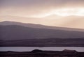 Epic Winter landscape image of view along Rannoch Moor during heavy rainfall giving misty look to the scene Royalty Free Stock Photo