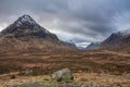 Epic Winter landscape looking across Rannoch Moor in Scottish Highlands towards Buachaille Etive Mor Stob Dearg snowcapped peak Royalty Free Stock Photo