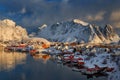 Epic winter seascape from Norway shot at sunrise with dynamic sky and pretty mountain