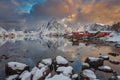 Epic winter seascape from Norway shot at sunrise with dynamic sky and pretty mountain