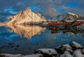 Epic winter seascape from Norway shot at sunrise with dynamic sky and pretty mountain