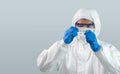 Epidemiological researchers in virus protective clothing are looking at blood samples