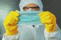 Epidemiologist holding Coronavirus respiratory mask