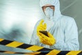 Epidemiologist using smartphone in hospital virus infection quarantine Royalty Free Stock Photo